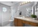 Bathroom with a tub and shower combo, vanity, mirror, and neutral decor at 2712 Lido Key Dr, Kissimmee, FL 34747