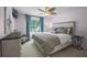 Cozy bedroom with soft colors, ceiling fan, and natural light from the large window at 2712 Lido Key Dr, Kissimmee, FL 34747