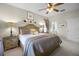 Comfortable bedroom featuring a bed, neutral decor, and a view of the attached bathroom at 2712 Lido Key Dr, Kissimmee, FL 34747