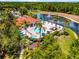 Elevated view of a resort-style community pool with a fountain, landscaping, and amenities at 2712 Lido Key Dr, Kissimmee, FL 34747