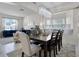 Elegant dining area with a large table, chairs, and bay windows, creating a perfect space for entertaining at 2712 Lido Key Dr, Kissimmee, FL 34747