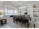 Charming dining area with a bay window seat, elegant lighting, and cozy seating, creating a warm and inviting space at 2712 Lido Key Dr, Kissimmee, FL 34747