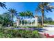 Elegant entryway to Emerald Island Resort, beautifully landscaped with a fountain, flowers and palm trees at 2712 Lido Key Dr, Kissimmee, FL 34747