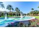 Water fountain with flowing water, beautiful statues, and lush landscaping at Emerald Island Resort community at 2712 Lido Key Dr, Kissimmee, FL 34747