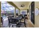 Screened-in patio featuring an outdoor dining area and comfortable seating at 2712 Lido Key Dr, Kissimmee, FL 34747