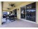 Screened-in patio featuring an outdoor dining area, ceiling fans, and bright neutral paint at 2712 Lido Key Dr, Kissimmee, FL 34747