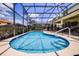 Enclosed pool area with blue water, lounge chairs, and secure perimeter fencing at 2712 Lido Key Dr, Kissimmee, FL 34747