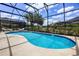 Screened-in pool with chaise lounge, with well maintained landscaping at 2712 Lido Key Dr, Kissimmee, FL 34747