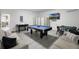 Spacious recreation room with pool table, foosball table, and comfortable seating at 2712 Lido Key Dr, Kissimmee, FL 34747