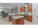 Well-appointed kitchen with stainless steel appliances, center island, and easy access to living area at 2721 Swoop Cir, Kissimmee, FL 34741