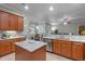 Stylish kitchen featuring granite countertops, modern appliances, custom cabinets, and an island at 2721 Swoop Cir, Kissimmee, FL 34741