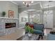 Inviting living room boasts stone fireplace, chandelier, and elegant decor creating a comfortable atmosphere at 2721 Swoop Cir, Kissimmee, FL 34741