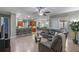 Open concept living space with kitchen, bar seating, dining and Gathering rooms, with tile flooring at 2721 Swoop Cir, Kissimmee, FL 34741
