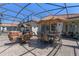 Large outdoor patio featuring a barbecue area, hot tub, and comfortable seating options, great for entertaining at 2721 Swoop Cir, Kissimmee, FL 34741