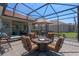 Inviting screened patio with a fire pit and comfortable seating, perfect for outdoor relaxation at 2721 Swoop Cir, Kissimmee, FL 34741