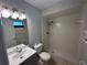 The bathroom offers a walk-in shower, a vanity with a sink, and a modern lighted mirror at 2813 Calico Ct, Orlando, FL 32822