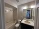 The bathroom offers a shower/tub combo, a vanity with a sink, and a mirror at 2813 Calico Ct, Orlando, FL 32822