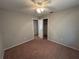 This bedroom has neutral walls, carpet, and closet space with a ceiling fan for comfortable living at 2813 Calico Ct, Orlando, FL 32822