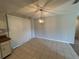 Bright dining area featuring tile flooring and modern light fixture, adjacent to the kitchen at 2813 Calico Ct, Orlando, FL 32822