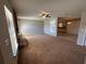 Spacious living room with carpet floors, a stone fireplace, and ample natural light at 2813 Calico Ct, Orlando, FL 32822