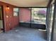 Enclosed patio with black screens offers relaxing view of the backyard at 2813 Calico Ct, Orlando, FL 32822