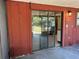 Enclosed patio with sliding glass doors opens to home's interior, offering space for outdoor living at 2813 Calico Ct, Orlando, FL 32822