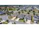 An expansive community of houses complete with solar panels, verdant lawns, and manicured landscaping showcases modern suburban living at 308 Buchannan Dr, Davenport, FL 33837