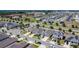 An aerial view of a well-planned community with homes that feature modern designs and solar panels, and include manicured lawns at 308 Buchannan Dr, Davenport, FL 33837