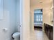 Inviting bathroom with a view of a serene bedroom, offering a tranquil and refreshing atmosphere at 308 Buchannan Dr, Davenport, FL 33837