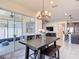 Bright dining area with a view of the outdoor patio and an elegant chandelier at 308 Buchannan Dr, Davenport, FL 33837