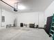 Clean garage with automatic opener, ladder, hot water heater, and lots of storage potential at 308 Buchannan Dr, Davenport, FL 33837