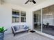 Covered patio with comfortable seating, providing a relaxing outdoor space at 308 Buchannan Dr, Davenport, FL 33837