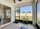 Relaxing screened patio with overhead fan, views to yard, and comfortable lounging at 308 Buchannan Dr, Davenport, FL 33837