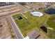 Aerial view showcasing the community amenities including a pool, playground and green space at 3134 Viceroy Ct, Poinciana, FL 34759