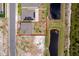 Aerial view of a house with an outlined lot, pond in the background and solar panels on an adjacent house at 3134 Viceroy Ct, Poinciana, FL 34759