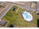 Aerial view showcasing the community amenities including a pool, playground and green space at 3134 Viceroy Ct, Poinciana, FL 34759