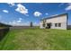 Large backyard area showcasing a privacy fence and space for outdoor activities at 3134 Viceroy Ct, Poinciana, FL 34759