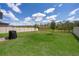 Spacious backyard featuring a grill and privacy fence at 3134 Viceroy Ct, Poinciana, FL 34759