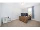 Bedroom featuring a natural light-filled room with a modern desk setup and neutral-toned carpet at 3134 Viceroy Ct, Poinciana, FL 34759