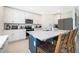 A spacious kitchen features an island, stainless steel appliances and bright white cabinets at 3134 Viceroy Ct, Poinciana, FL 34759