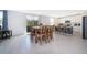 Bright and open living room dining room and kitchen area with tile flooring at 3134 Viceroy Ct, Poinciana, FL 34759