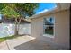 A concrete patio area provides outdoor space, enhanced by a vibrant tree canopy at 3220 Harpers Ferry Ct, Orlando, FL 32837
