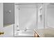 Well-maintained bathroom featuring a shower-tub combination, white tile, a window and a vanity with wood cabinets at 3220 Harpers Ferry Ct, Orlando, FL 32837