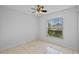 Cozy bedroom with tiled floors and a window overlooking the neighborhood at 3220 Harpers Ferry Ct, Orlando, FL 32837