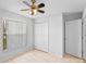 Bedroom with tiled floors, a ceiling fan, closet, and window at 3220 Harpers Ferry Ct, Orlando, FL 32837