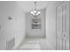 Bright breakfast nook with tile flooring, window, and modern lighting, adjacent to a closet at 3220 Harpers Ferry Ct, Orlando, FL 32837