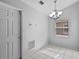 Bright breakfast nook featuring tile flooring, modern chandelier, and a large window for natural light at 3220 Harpers Ferry Ct, Orlando, FL 32837