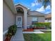 Inviting front entry features a secure screen door, manicured landscaping, and an ADT security system sign at 3220 Harpers Ferry Ct, Orlando, FL 32837