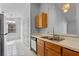 This kitchen features wooden cabinets, a stainless steel sink, and views into a bright breakfast nook at 3220 Harpers Ferry Ct, Orlando, FL 32837