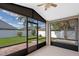 Screened-in lanai offering a view of the lush green backyard and fence at 3220 Harpers Ferry Ct, Orlando, FL 32837